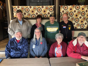 Group picture of pizza at Brothers Three